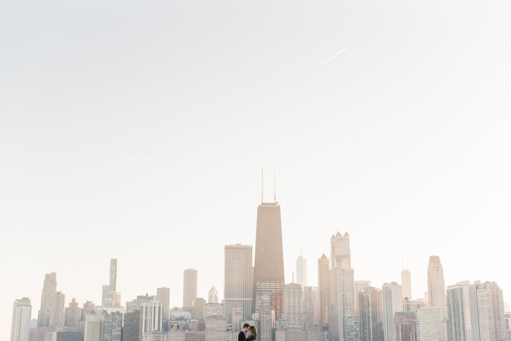 engagement photos of a couple taken at north avenue beach in chicago