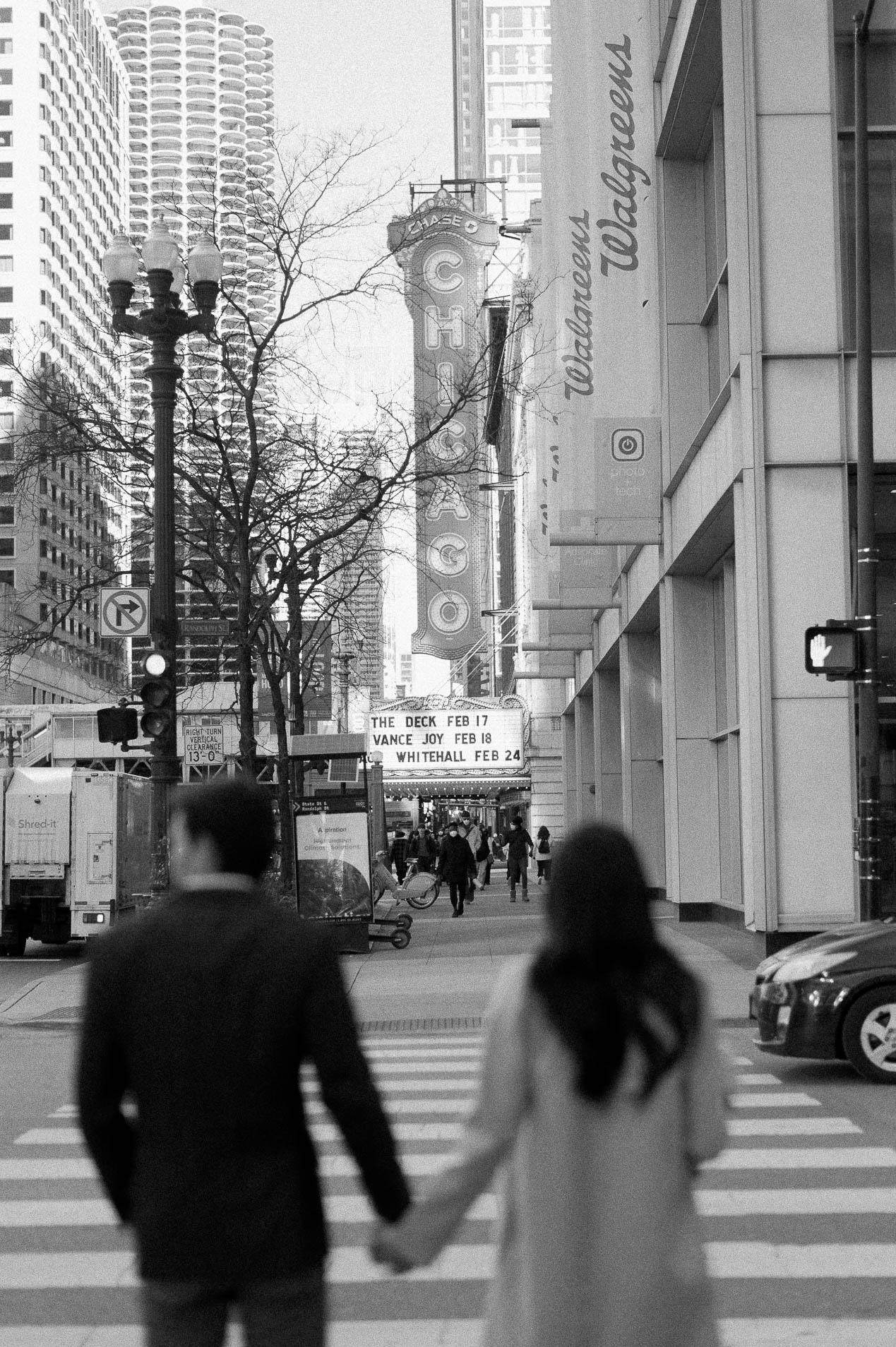 a couple outside of the chicago theatre after their elopement
