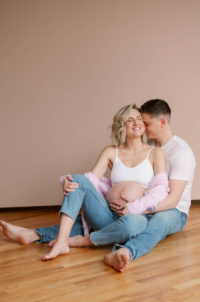 chicago couple photographed in a studio for maternity photos in wicker park
