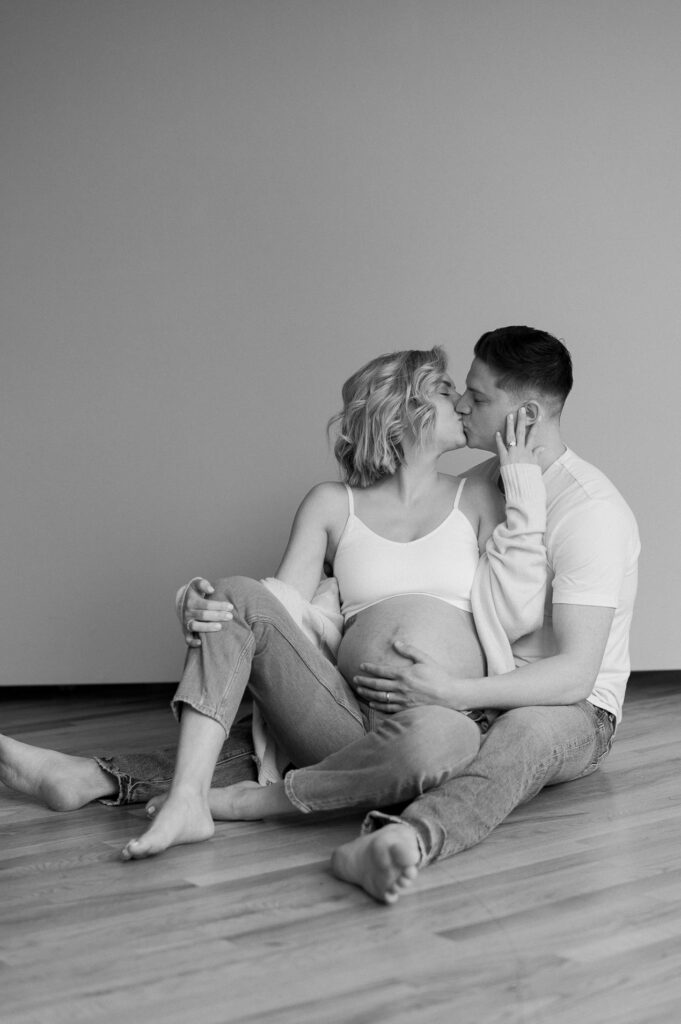 chicago couple photographed in a studio for maternity photos in wicker park