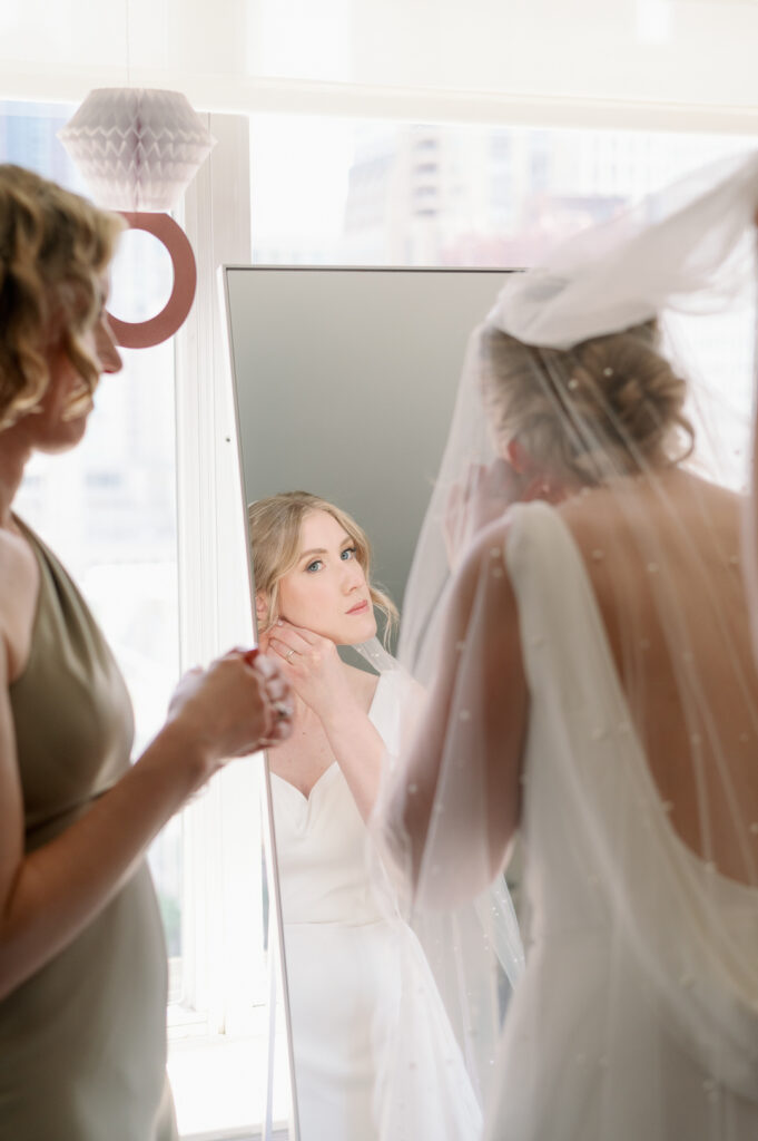 bride getting ready in her dress from lovely bride chicago 