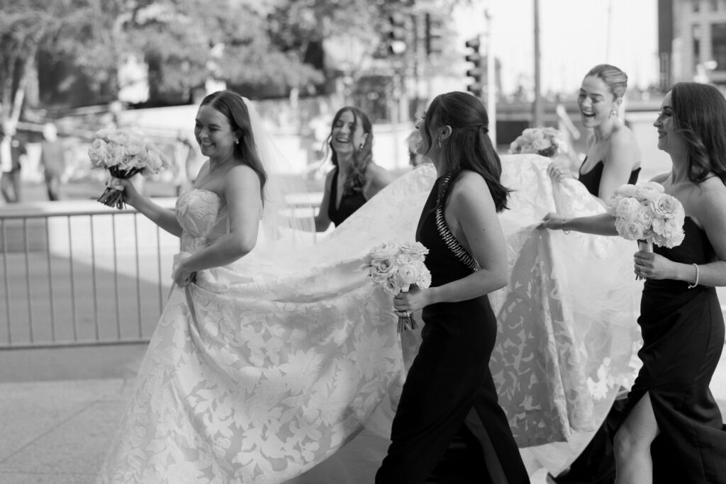 wedding party photos taken in downtown chicago near the chicago river 