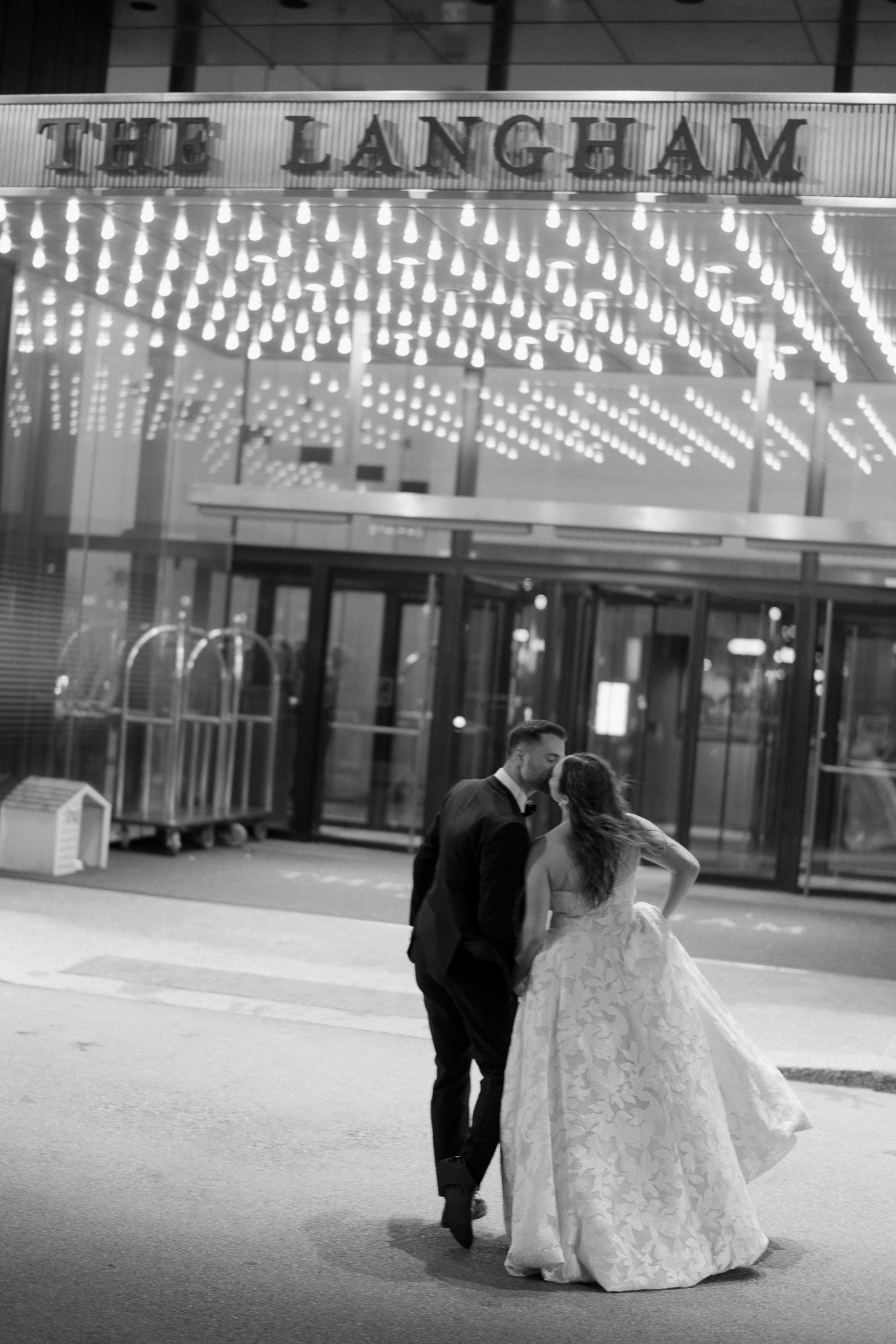 langham chicago wedding photos outside of the hotel at night
